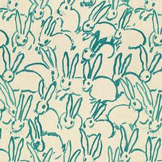 a blue and white background with rabbits on it