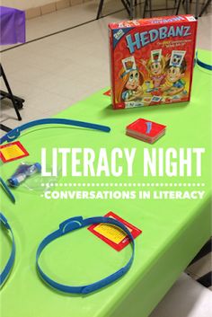 a green table topped with a book and game