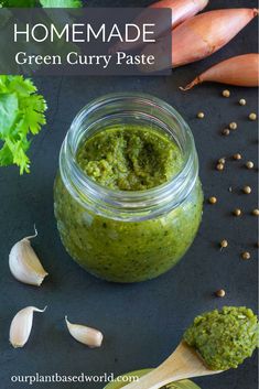 homemade green curry paste in a glass jar with garlic, carrots and parsley