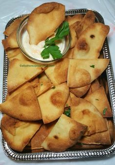 some food is on a silver tray and ready to be eaten