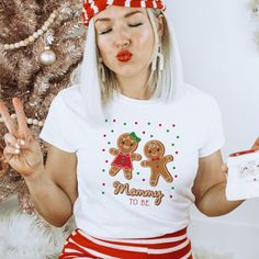 a woman with white hair wearing a red and white christmas outfit