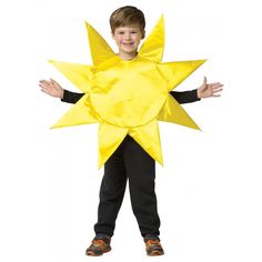 a young boy wearing a yellow star costume