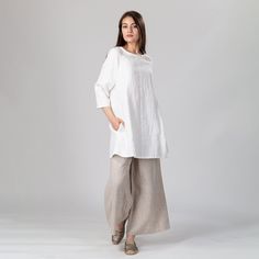 "Slow fashion short linen tunic dress with 3/4 raglan sleeves and concealed side pockets. Versatile design, perfect on its own as a mini dress or paired with your favorite jeans or pants as a tunic. Gentle A-line silhouette and an loose cut for a relaxed and comfortable feel. Shown here in Snow White 250 gsm medium weight linen. SIZING: To choose the right size, check out our body measurements chart displayed in the product listing photos. If you need specific sizing recommendations, please don' Daywear Linen Dress With 3/4 Sleeves, Linen Dress With 3/4 Sleeves For Daywear, White Linen Short Sleeve Tunic, Linen Dress With Relaxed Fit And 3/4 Sleeves, Relaxed Fit Linen Dress With 3/4 Sleeve, Body Measurements Chart, Short Linen Dress, Flared Mini Dress, Body Measurement Chart