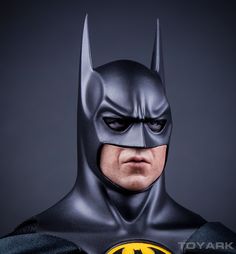 the batman statue is shown in full costume