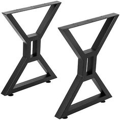 two black metal side tables sitting next to each other on top of a white background