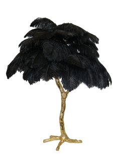 an ostrich's head is placed on top of a gold base with black feathers