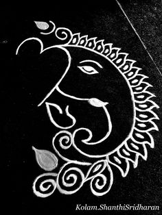 an intricately designed ganeshi on the ground in black - and - white