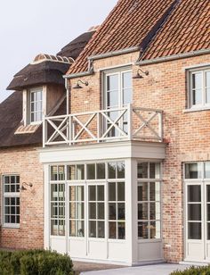 a brick building with white doors and windows