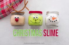 three jars with faces painted on them and the words christmas slime