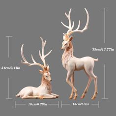 two white deer statues sitting next to each other on a gray background, with measurements