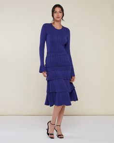 Made from a ribbed sweater knit, this Midi Dress is designed with a fitted crewneck top that gives way to a floaty A-line hem. Ruffled pointelle trim details the cuffs and the skirt’s tiers. Pointelle detail at bodice/sleeves/ruffles Ribbed knit pattern at body Crew neckline Midi length Fitted body/A-line skirt 65% Viscose 35% Nylon Hand wash cool water. Do not bleach. Do not tumble dry. Hang dry. Do not iron. Rachel Parcell, Ribbed Midi Dress, Knit Pattern, Trim Detail, Sweater Knit, Ribbed Sweater, Knit Patterns, A Line Skirt, A Line Skirts