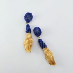 I am always in search of different styles and creating new techniques to make unique jewelry. I'm so excited to show these new unique dangle shell earrings handcrafted with high-quality glass seed beads and natural shells that I found on Portuguese beaches. After totally embroidered by hand the earrings were covered with a specific resin layer to protect and maintain the brightness. For this process, it's necessary long 7 days to dry totally. A cute and delicate piece perfect for summer days or Seed Beads Earrings, Bead Dangle Earrings, Earrings Beach, Seashell Earrings, Handmade Earrings Beaded, Beaded Drop Earrings, Summer Earring, Beaded Dangle Earrings, Shell Earrings