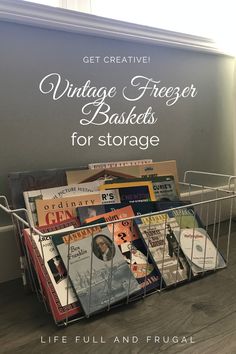 a basket filled with books sitting on top of a wooden floor