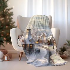 a christmas scene is shown on the back of a chair in front of a tree