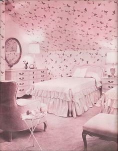 an old photo of a bedroom decorated in pink and white with birds on the wall