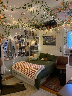 a bedroom decorated with lights and pictures on the wall