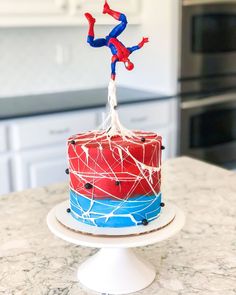 a spiderman cake on top of a kitchen counter