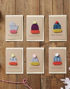 six handmade christmas cards with knitted hats on them