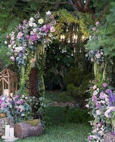 an outdoor ceremony with flowers and candles