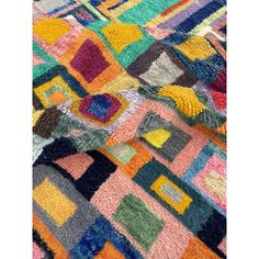 an area rug with multicolored squares on it