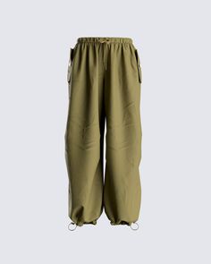 The ultimate comfy, but stylish look 🙌 These green parachute pants are made from swishy fabric, and complete with pleats, an elastic drawstring waistband, adjustable elastic leg cuffs, cargo side seam pockets, and a mid-rise fit 💚 Wellness Consultant, Green Parachute Pants, Fashion Athleisure, Clothing Png, White Corset Dress, Parachute Pant, Tech Wear, Future Of Fashion, Yellow Mini Dress