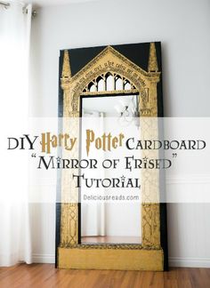 a mirror sitting on top of a wooden floor in front of a white wall with the words diy harry potter cardboard mirror