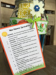 a new mommy survival kit in a glass jar with a note attached to the top