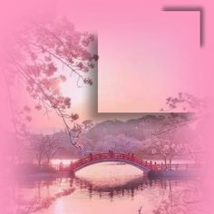 a bridge over a body of water with trees in the foreground and a pink sky behind it