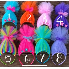 the numbers are displayed in different colors of tutues and hair accessories for children