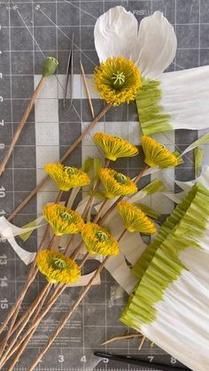 the flowers are being used to make paper flowers