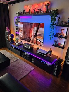 a living room filled with furniture and a flat screen tv on top of a wall