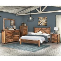 a bedroom scene with focus on the bed, dresser and nightstands that are made out of wood