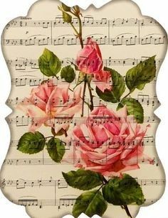 pink roses on sheet music with green leaves