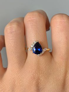 Introducing our newest redesign, this gorgeous, timeless ring features our favorite stunning sapphire and hand picked crystal ring. ✦ DETAILS ✦ ✧ Handcrafted ✧ 1.50 Carat center stone ✧ Natural gemstones ✧ Sizes 3.75-11.25 ✧ Gold over Sterling Silver 925 ✧ This ring will arrive ready to gift in a Kherish Jewelry Pouch. ✧ PRE-ORDER: Items that are preorder only will ship within 10-15 business days. You will receive an email with the updated processing time if you order a size/option that qualifie Ring Cuts, Timeless Ring, Ring Crystal, Sapphire Rings, Gold Filled Ring, Engagement Ring Cuts, Jewelry Sterling Silver, Minimalist Ring, Crystal Ring