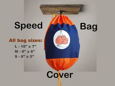 an orange and blue bag hanging from a wooden hanger with the words speed bags on it