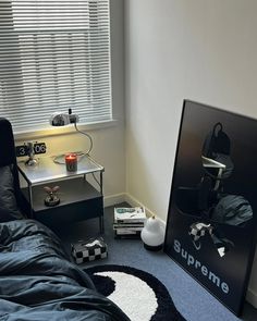 a bed room with a large poster on the wall