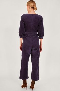 It's cord season. Suitable for any time of the day, this purple jumpsuit features cropped blouson sleeves, a defined waist and kick flare trousers. Evening plans? Just slip on some boots. As part of the journey to make our clothes kinder to the world around us, this item was made using more sustainable raw materials, such as organic cotton, recycled polyester and viscose from responsibly grown forests. Purple Jumpsuit, Defined Waist, Party Skirt, Kick Flares, Flare Trousers, Navy Dress, Embellished Dress, Denim Outfit, Jeans For Sale