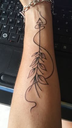 a person with a tattoo on their arm