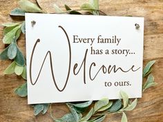 a sign that says, every family has a story welcome to ourss