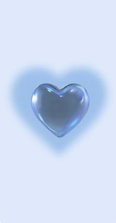 a blue heart shaped object floating in the air