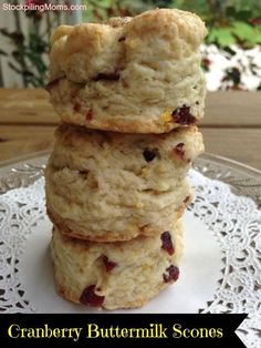 three cranberry buttermilk scones stacked on top of each other with text overlay