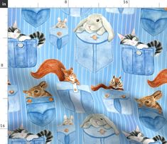 a blue fabric with cats and dogs in pockets