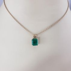 14K Yellow Gold Emerald Pendant JAGi Certified  This stunning pendant features one emerald cut natural emerald (8.6 mm x 7.5 mm) set in classic 14K yellow gold.  Emerald weight: 2.02 ct.  Size: 14 mm x 7.5 mm  Stamped: 14K  Weight:  0.8 dwt./ 1.25 gr.  JAGi Certificate included.  *Chain not included.  Very good condition, professionally polished.  Will come packaged in a gift box or pouch (when possible) and will be shipped U.S. Priority Mail Insured. Gold Emerald Cut Emerald Necklace, Luxury 14k Gold Emerald-cut Emerald Necklace, Classic Gold Emerald Cut Emerald Necklace, Classic Gold Emerald Cut Necklace, Classic 14k Gold Emerald Cut Emerald Necklace, 14k Yellow Gold Emerald-cut Emerald Necklace, 14k Gold Emerald Cut Gemstone Necklace, Classic Yellow Gold Emerald Cut Necklace, Gold Emerald Cut Necklace For May Birthstone