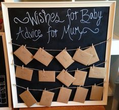 a chalkboard with notes attached to it that says wishes for baby advice for mums