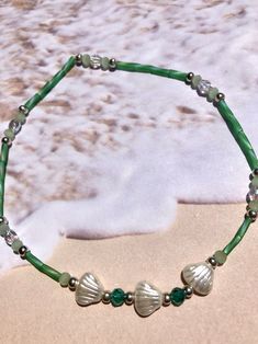 "Lovely matte green frosted ab bugle beads remind me of sea glass. White pearlized glass shell beads along with green ab facetted firepolished crystal beads and clear ab facetted beads. This will fit 8 1/2 to 10 1/2\" ankle as it is on clear stretch cord. Please see my other listings for more beach themed ankle bracelets." Bracelets Green, Matte Green, Bugle Beads, Ankle Bracelet, Pearl Shell, Beach Themed, Anklet Jewelry, Body Jewellery, Shell Beads