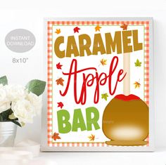 a poster with the words caramel apple bar on it next to some white flowers