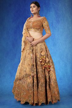 A beautiful rust-colored organza ensemble, adorned with intricate sequin threadwork, stonework, and cutdana. The exquisite craftsmanship is highlighted by the rich, textured fabric, making it a piece that stands out. WASH CARE INSTRUCTIONS - Please Dry clean only when it is applicable! Ready to Ship! Embellished Tissue Silk Lehenga For Festivals, Bollywood Style Embellished Tissue Silk Lehenga, Unstitched Hand Embellished Lehenga In Organza, Unstitched Embellished Blouse Piece For Wedding, Unstitched Embellished Wedding Blouse Piece, Wedding Embellished Unstitched Blouse Piece, Hand Embellished Lehenga For Festivals, Bollywood Hand Embellished Organza Lehenga, Elegant Art Silk Choli With Intricate Embroidery