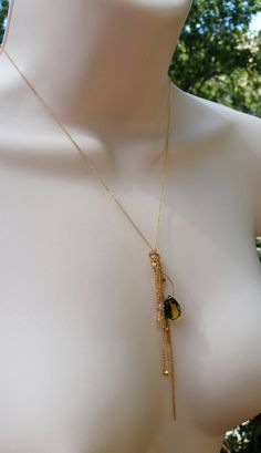 "I designed this necklace for Stassi based on the color and shape of the stone. Stassi loves the green and yellow colors in the quartz teardrop stone (12mm X 14mm). She wanted me to create a necklace based off her \"Boho\" style. This necklace can be made in sterling silver or 14k gold fill flat cable chain. The chains fall like a \"messy\" tassel, all different lengths. There are several citrine stones and 22k gold plated nuggets that are at the bottom of some of the chains. There are several s Gold Teardrop Drop Necklace With Natural Stones, Green Drop-shape Birthstone Necklace, Green Teardrop Gemstone Drop Necklace, Green Teardrop Necklace With Adjustable Chain, Green Teardrop Jewelry With Adjustable Chain, Citrine Stone, Yellow And Green, Green And Yellow, 22k Gold