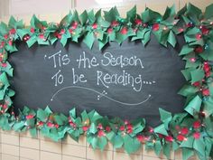 a blackboard with green and red decorations on it that says tis the season to be reading