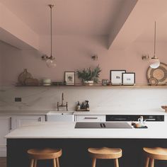 the kitchen counter is clean and ready to be used as a breakfast bar or seating area